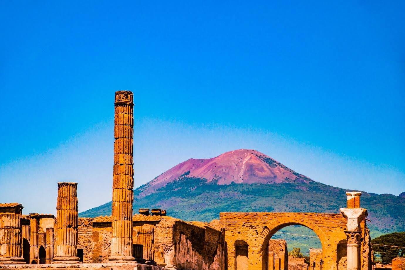 Front view of pompeii ruins in Italy.Mount Vesuvius shown in the backgraound.